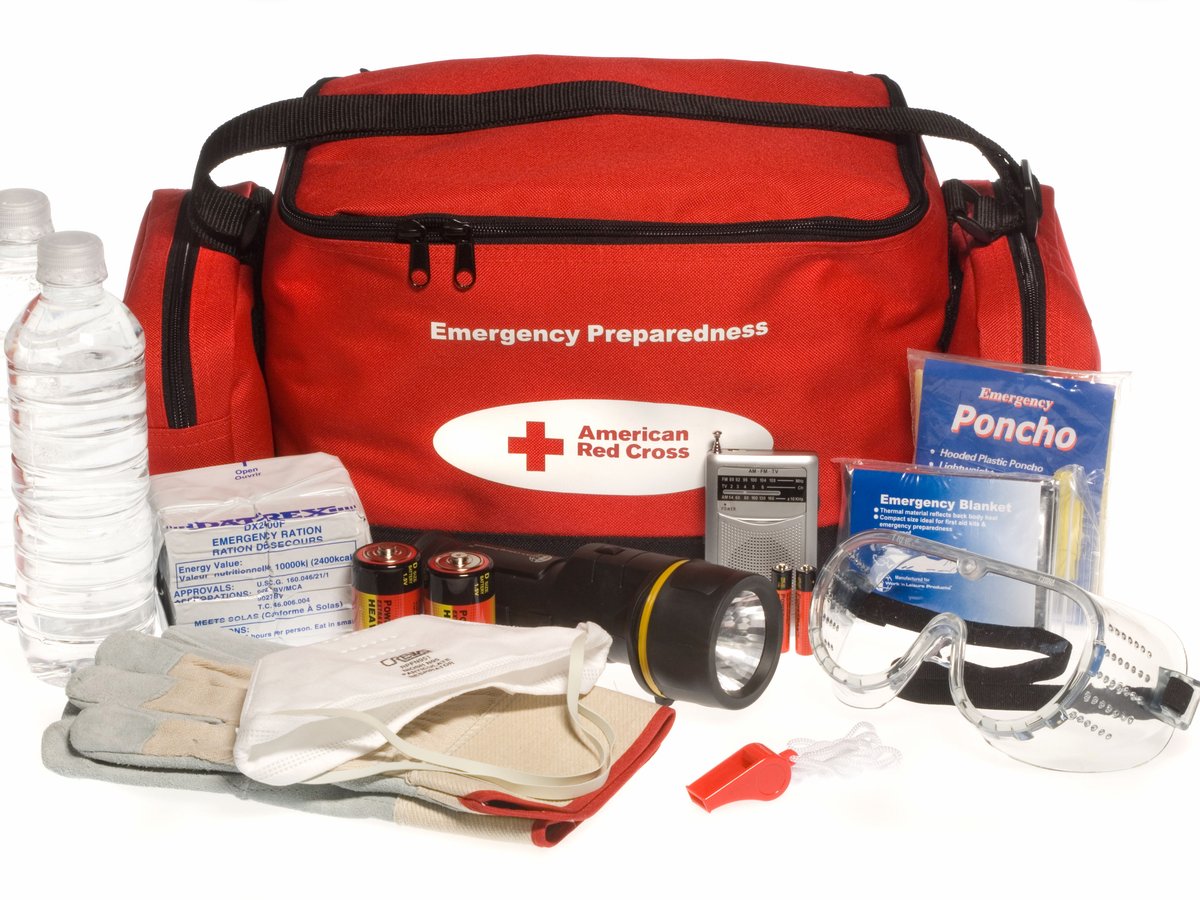 An emergency kit with a crank radio, flashlight and batteries