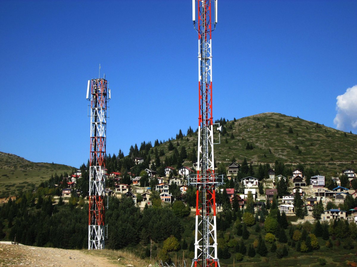A radio tower with antennas against a clear sky
